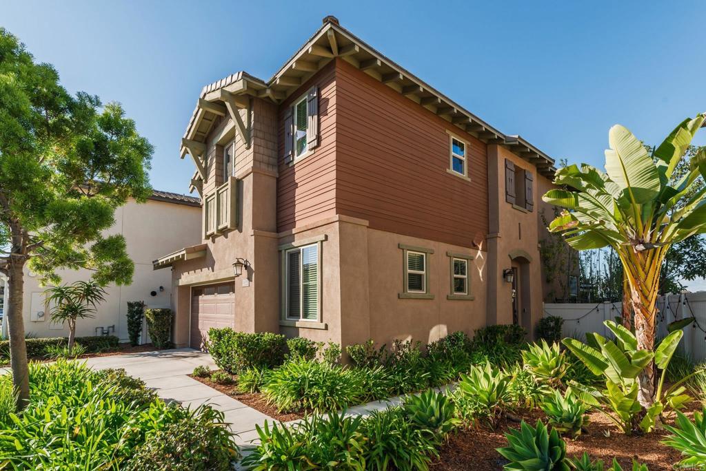 1244 Via Candelas Oceanside, CA 92056 - Photo 7 of 60 a front view of a house with a garden