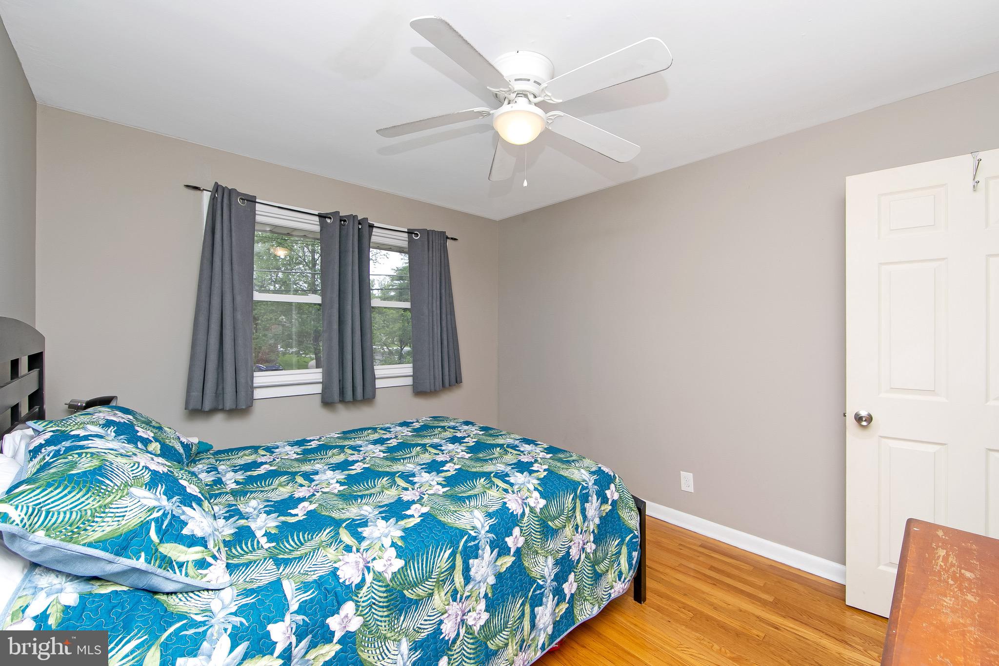 421 Yorkshire Road Cherry Hill, NJ 08034 - Photo 18 of 38 a bedroom with a bed and a large window