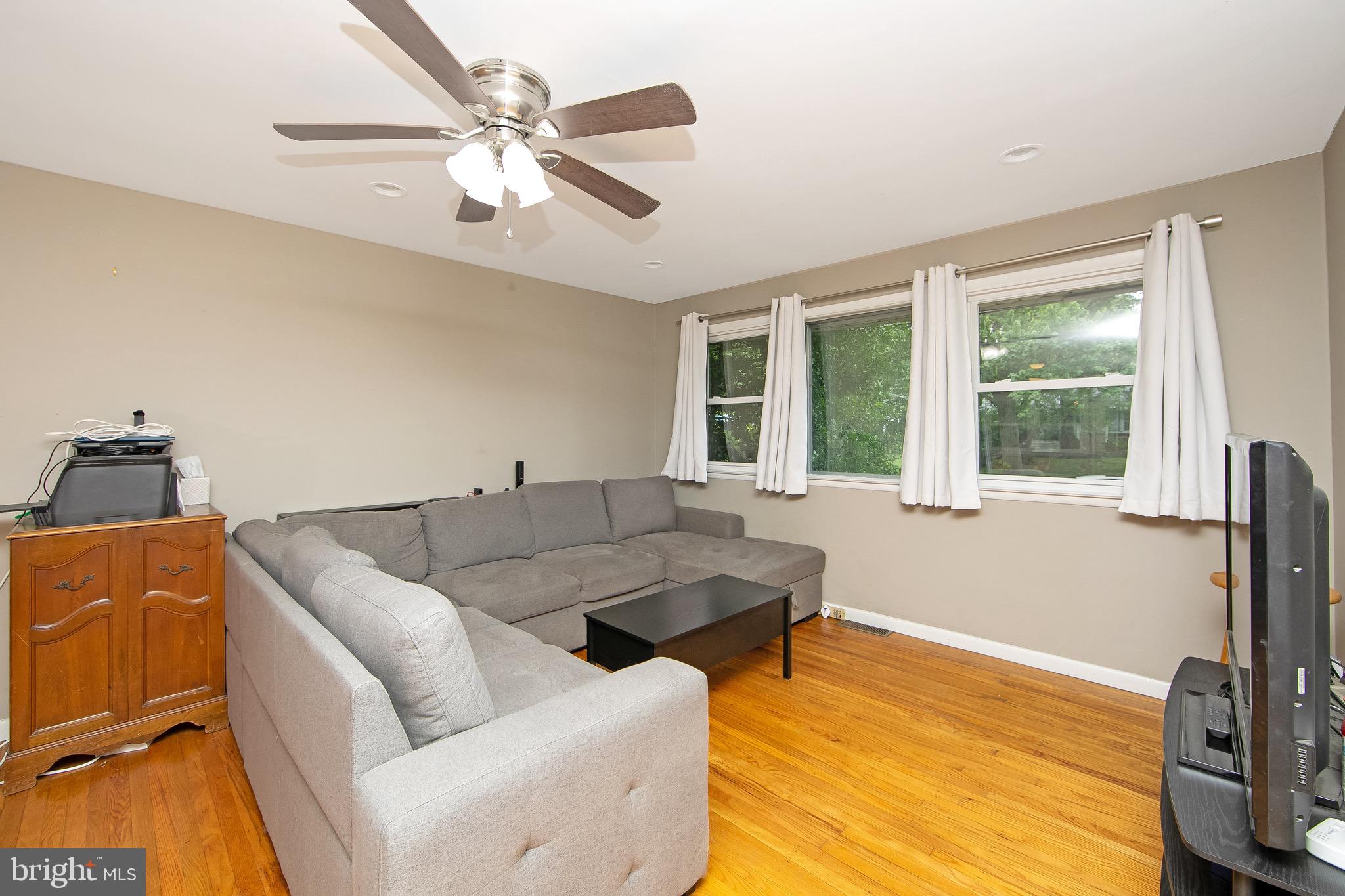 421 Yorkshire Road Cherry Hill, NJ 08034 - Photo 3 of 38 a living room with furniture and a large window