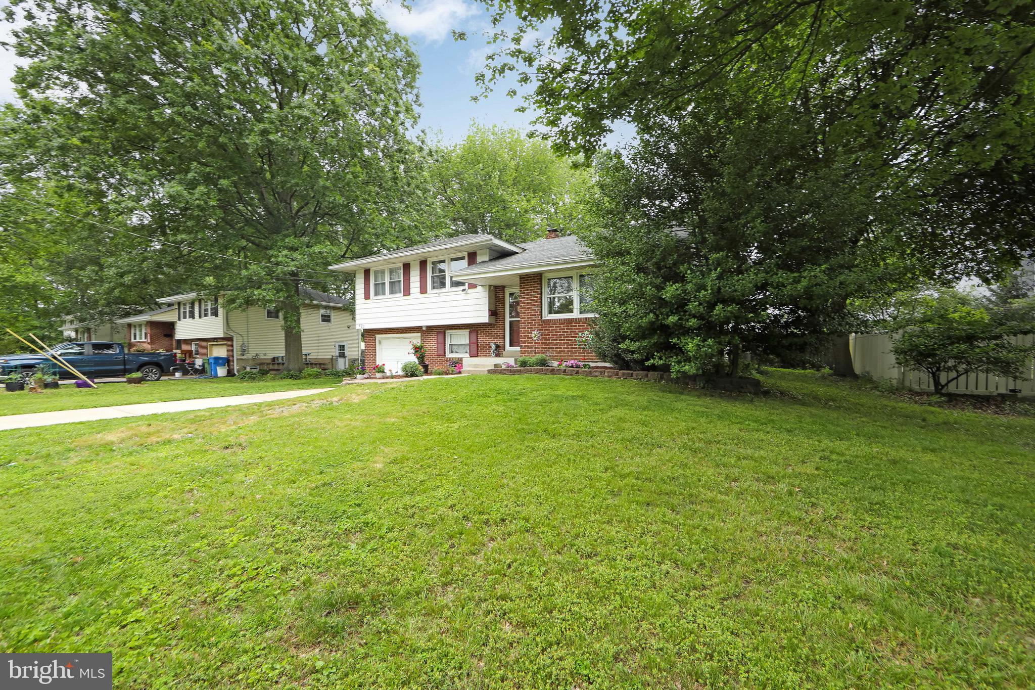 421 Yorkshire Road Cherry Hill, NJ 08034 - Photo 32 of 38 a front view of a house with garden