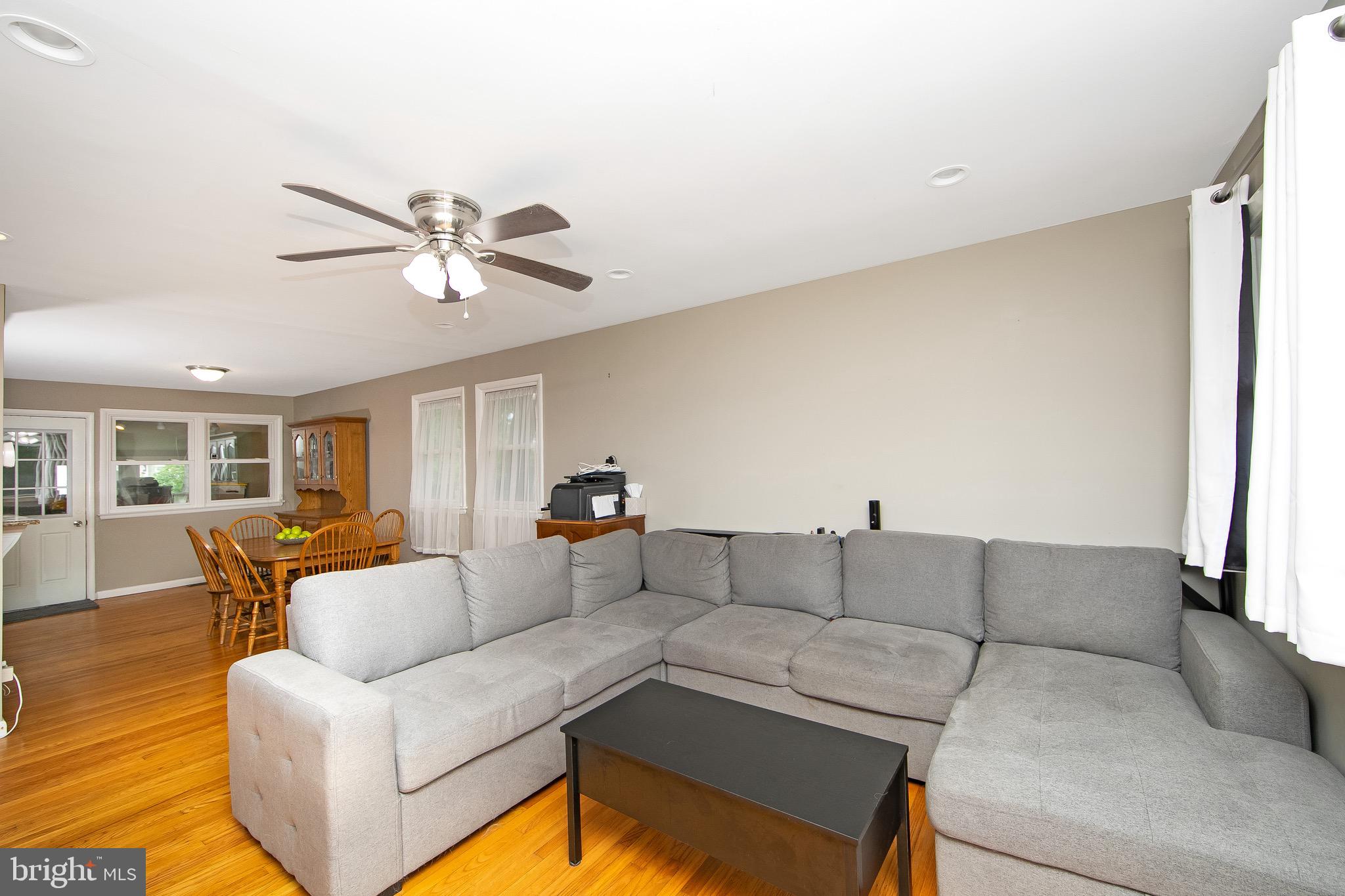 421 Yorkshire Road Cherry Hill, NJ 08034 - Photo 4 of 38 a living room with furniture and a large window
