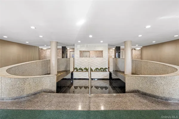 a view of a large living room with kitchen