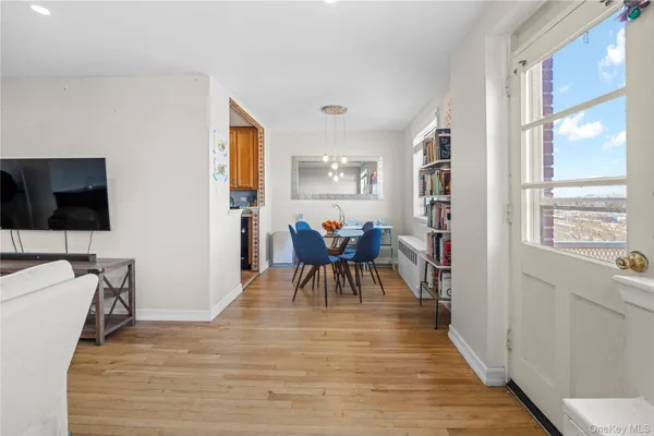 a view of a livingroom with furniture and a flat screen tv