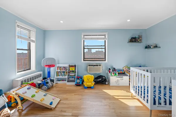a bedroom with furniture and a window