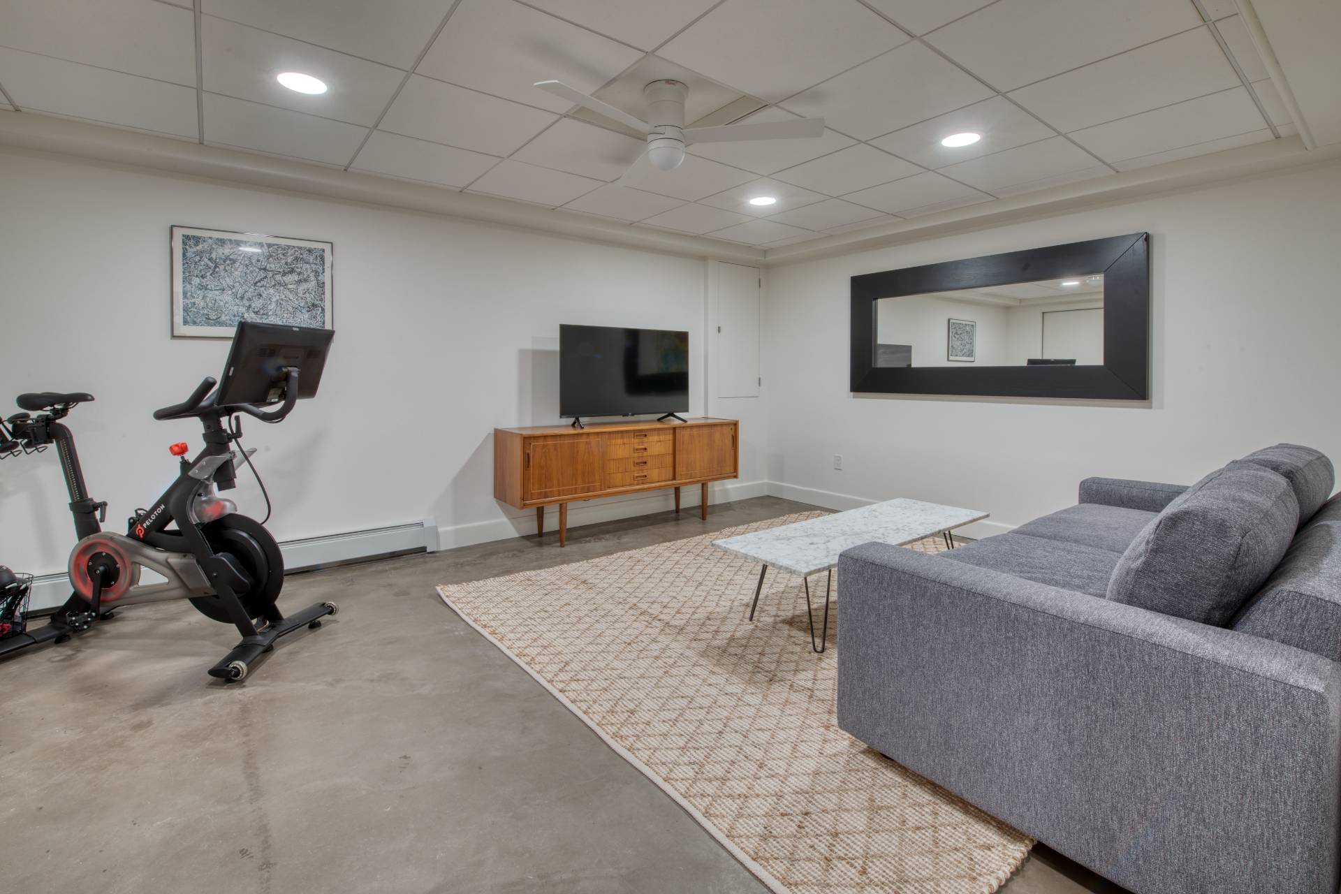 16 4th Street East Hampton, NY 11937 - Photo 15 of 18 a living room with furniture and a flat screen tv