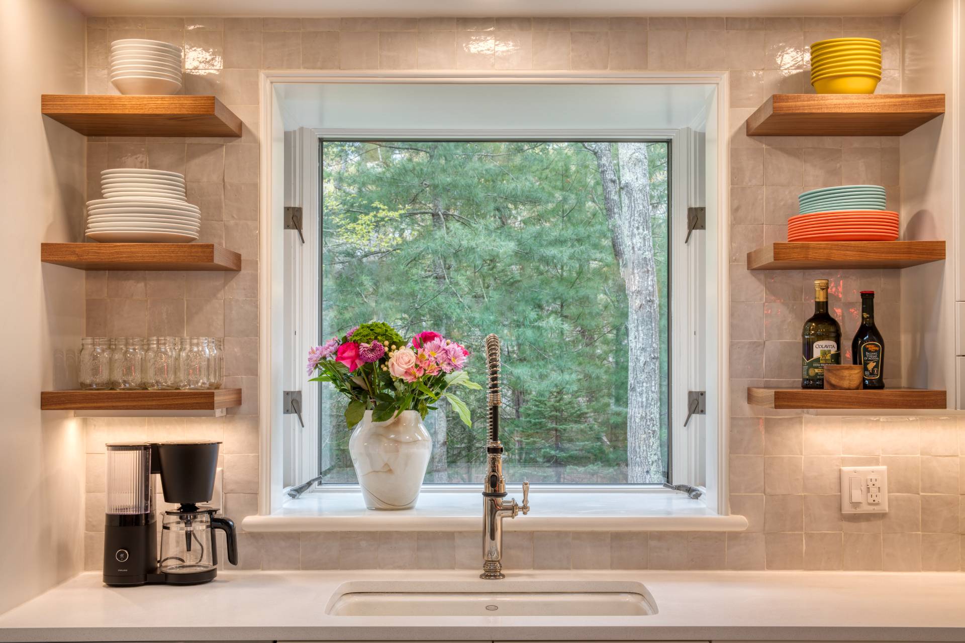 16 4th Street East Hampton, NY 11937 - Photo 18 of 18 a hallway with beautiful flowers and a table