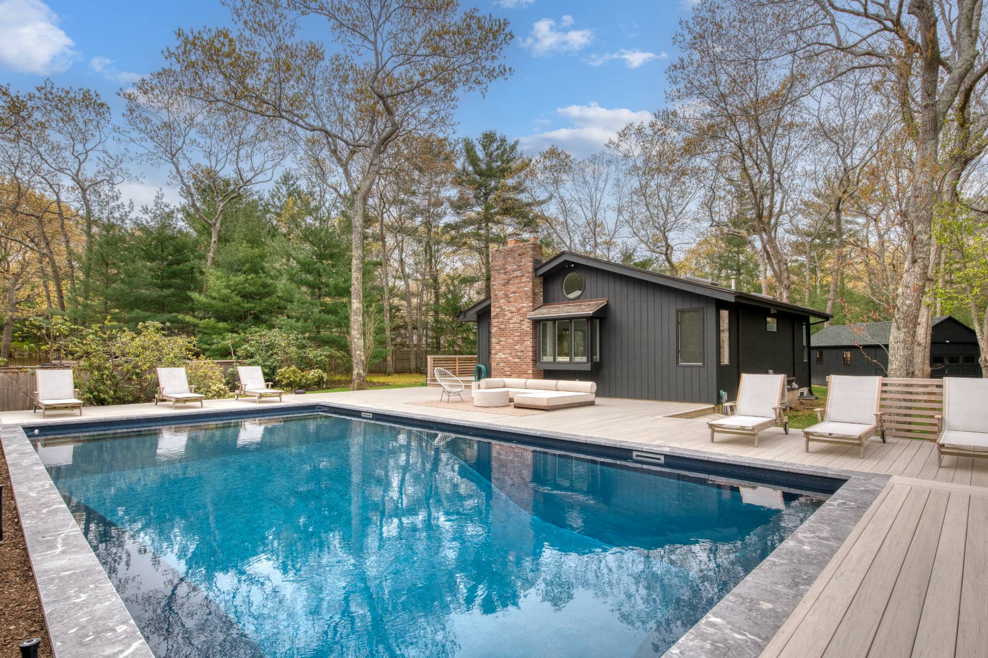 16 4th Street East Hampton, NY 11937 - Photo 3 of 18 a view of a house with pool and sitting area