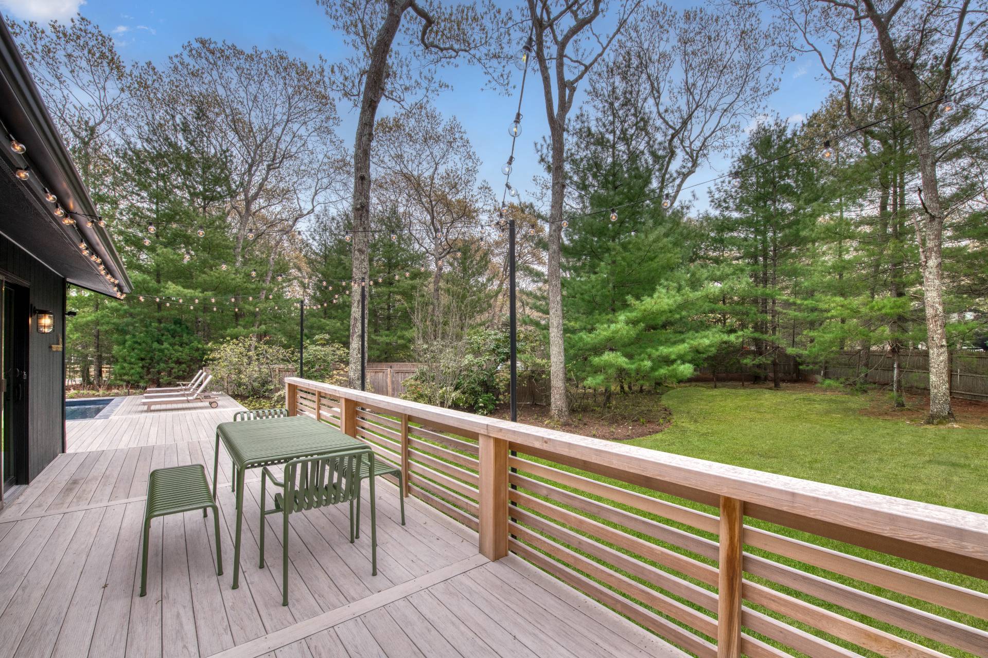 16 4th Street East Hampton, NY 11937 - Photo 4 of 18 a view of backyard with a deck and hardwood floor