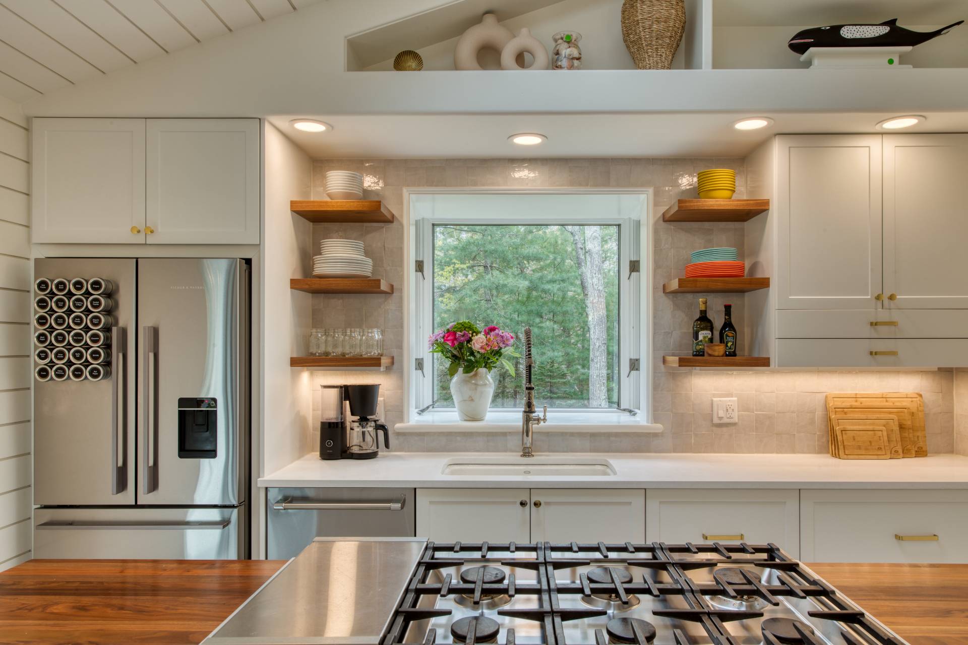 16 4th Street East Hampton, NY 11937 - Photo 5 of 18 a kitchen with a sink and a refrigerator