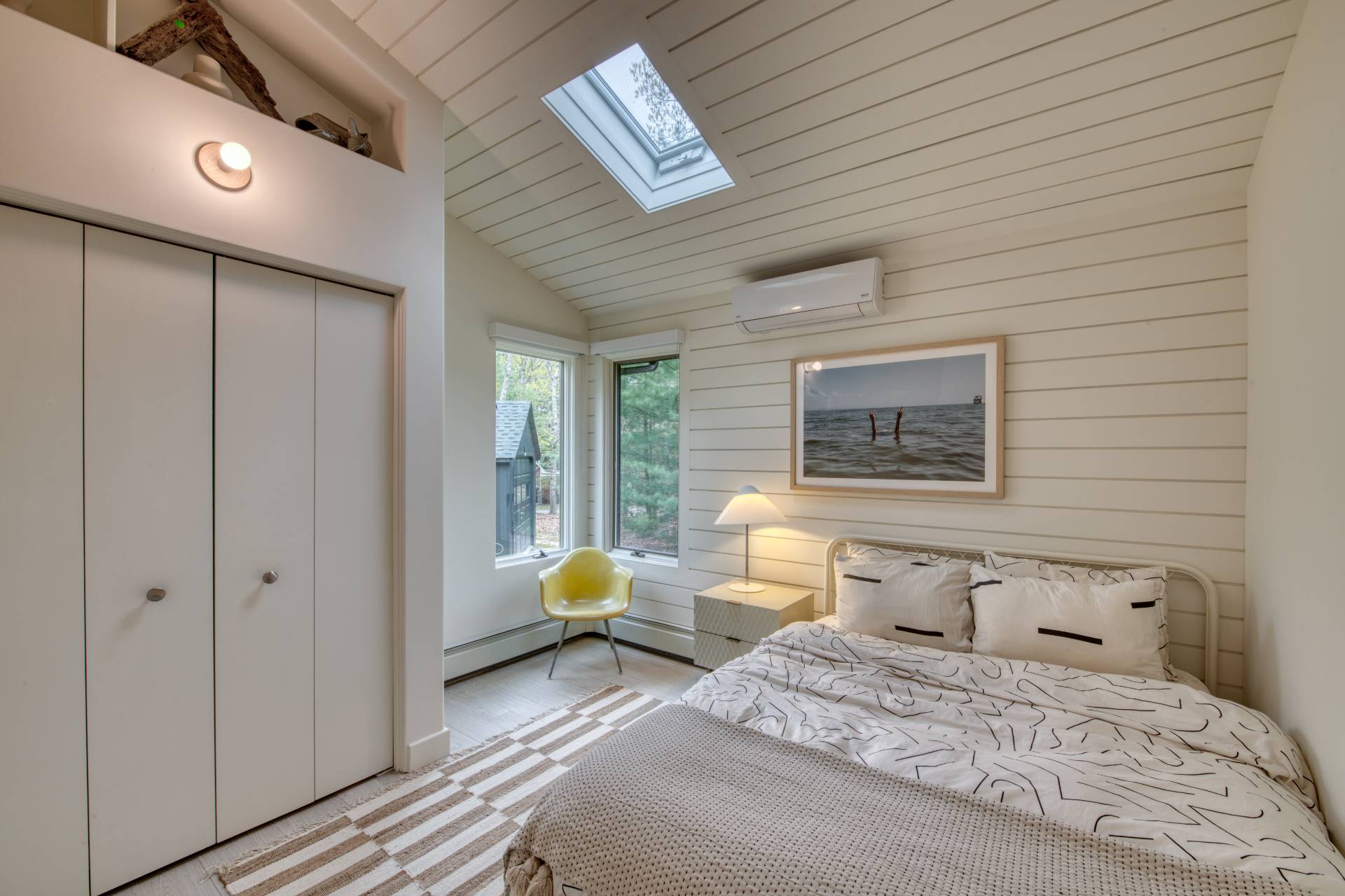 16 4th Street East Hampton, NY 11937 - Photo 10 of 18 a bedroom with a bed and wooden floor