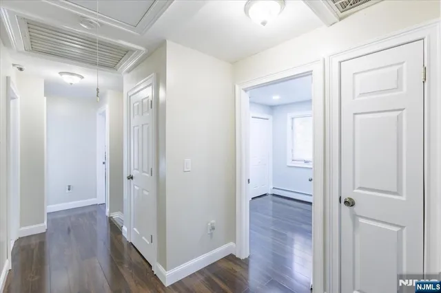 wooden floor with white walls