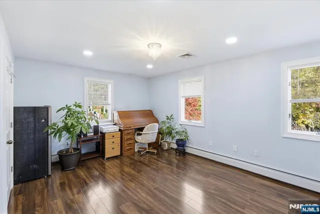 a workspace with furniture and a potted plant