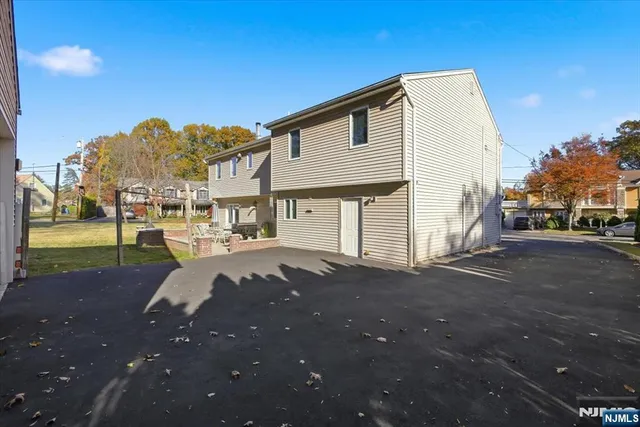 a view of a street with a building in the background