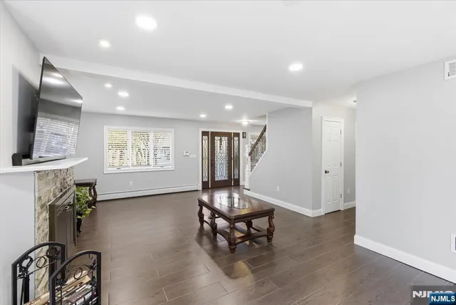 a view of a livingroom with furniture and a window
