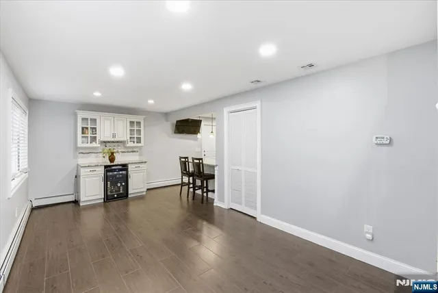 a view of kitchen with microwave and furniture