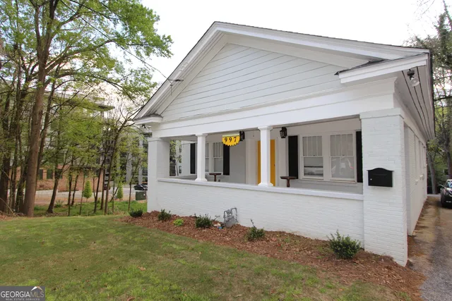 front view of a house with a yard