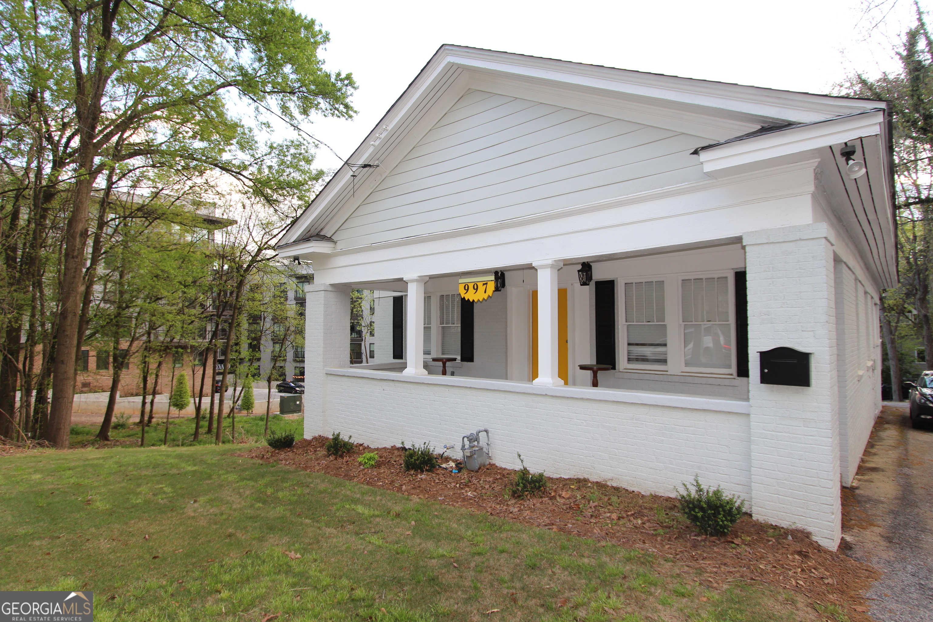 front view of a house with a yard