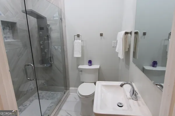 a bathroom with a sink and a toilet