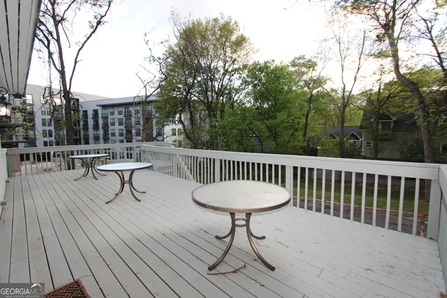a view of a chairs on wooden deck