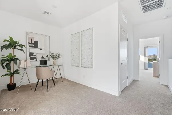 a workspace with furniture and a potted plant