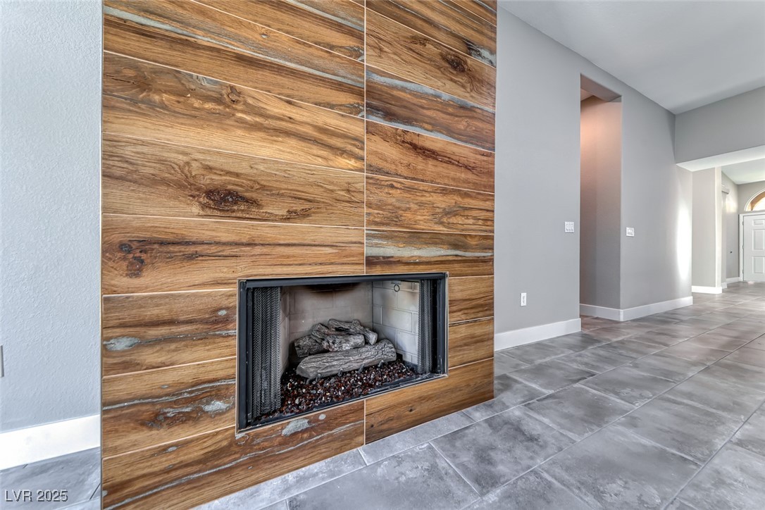 2401 Flower Spring Street Las Vegas, NV 89134 - Photo 23 of 42 Detailed view of a fireplace and baseboards