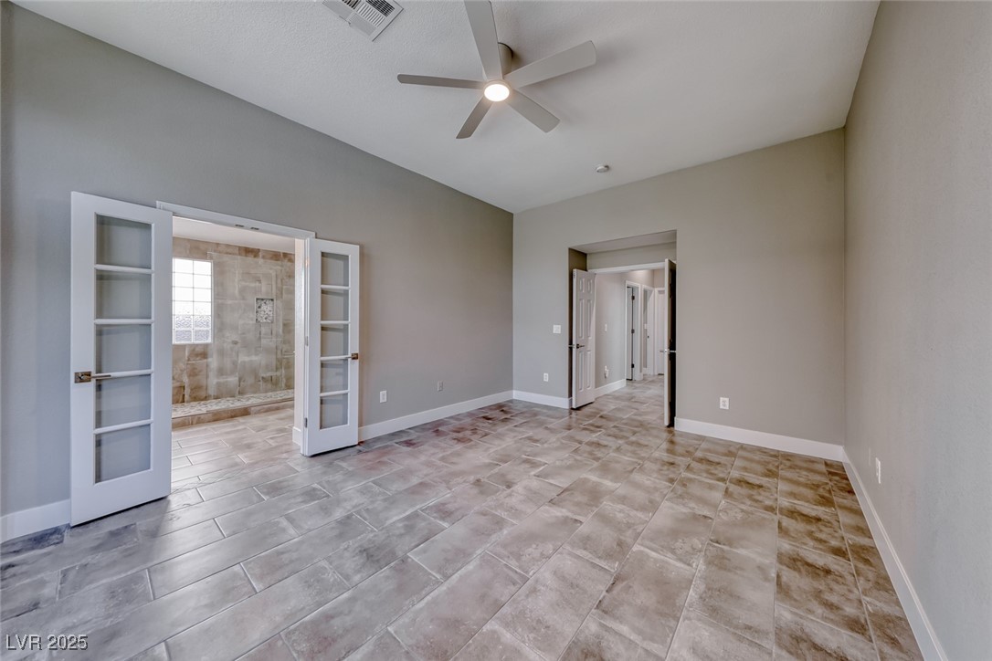 2401 Flower Spring Street Las Vegas, NV 89134 - Photo 25 of 42 Unfurnished room featuring french doors and a ceiling fan
