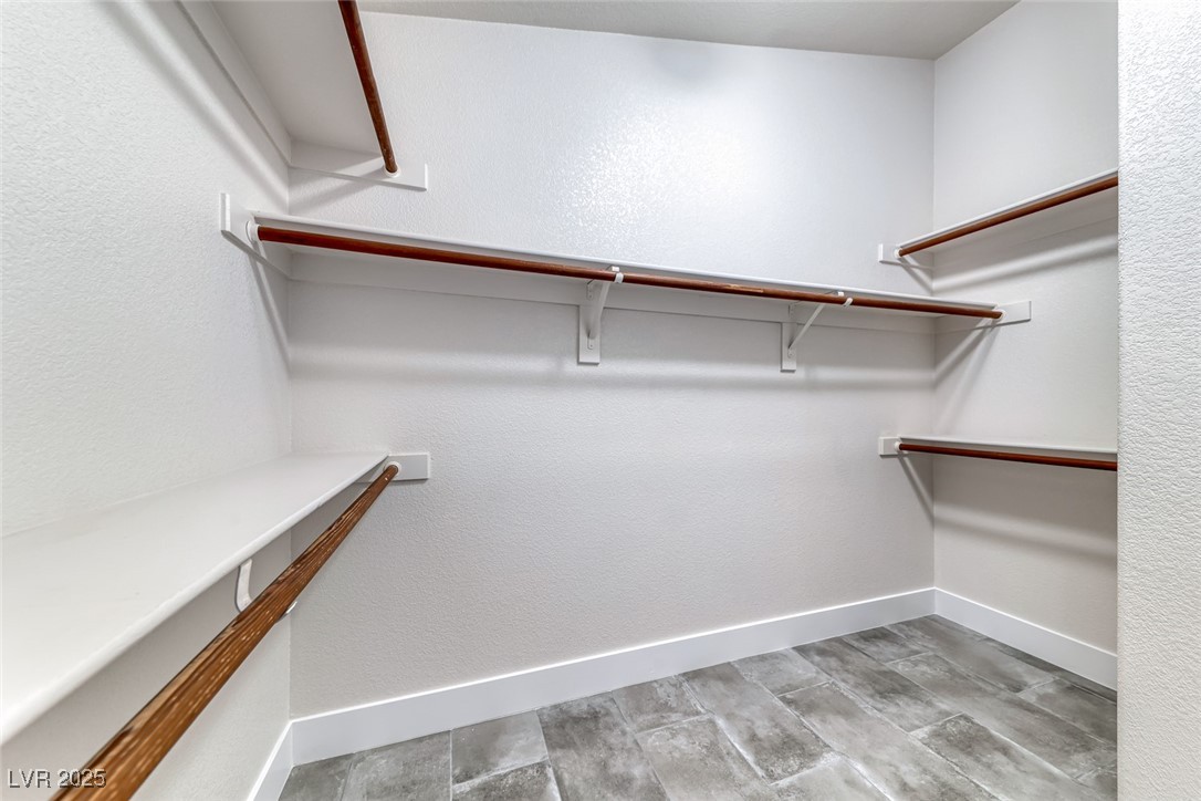 2401 Flower Spring Street Las Vegas, NV 89134 - Photo 30 of 42 Walk in closet with light wood finished floors