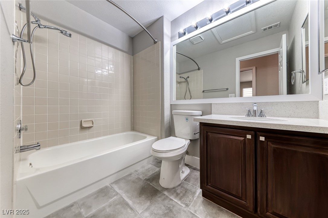 2401 Flower Spring Street Las Vegas, NV 89134 - Photo 33 of 42 Full bath featuring shower / bathtub combination with curtain, vanity, and light tile patterned floors