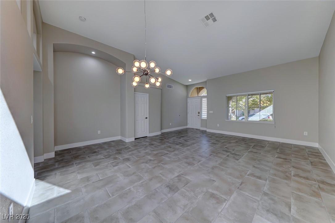 2401 Flower Spring Street Las Vegas, NV 89134 - Photo 9 of 42 Unfurnished living room with a chandelier and recessed lighting