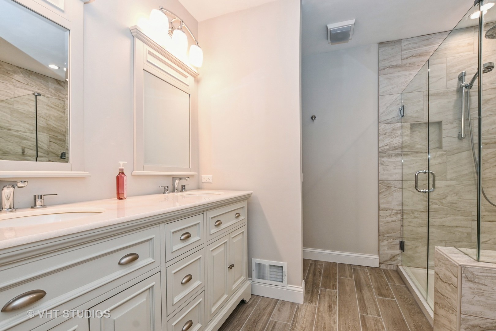 14740 Pine Tree Road Orland Park, IL 60462 - Photo 11 of 25 a spacious bathroom with a double vanity sink a mirror and shower