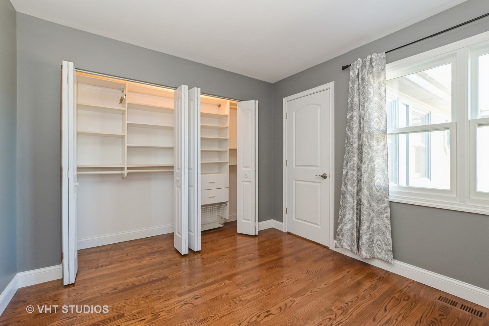 14740 Pine Tree Road Orland Park, IL 60462 - Photo 18 of 25 a view of empty room with wooden floor and fan