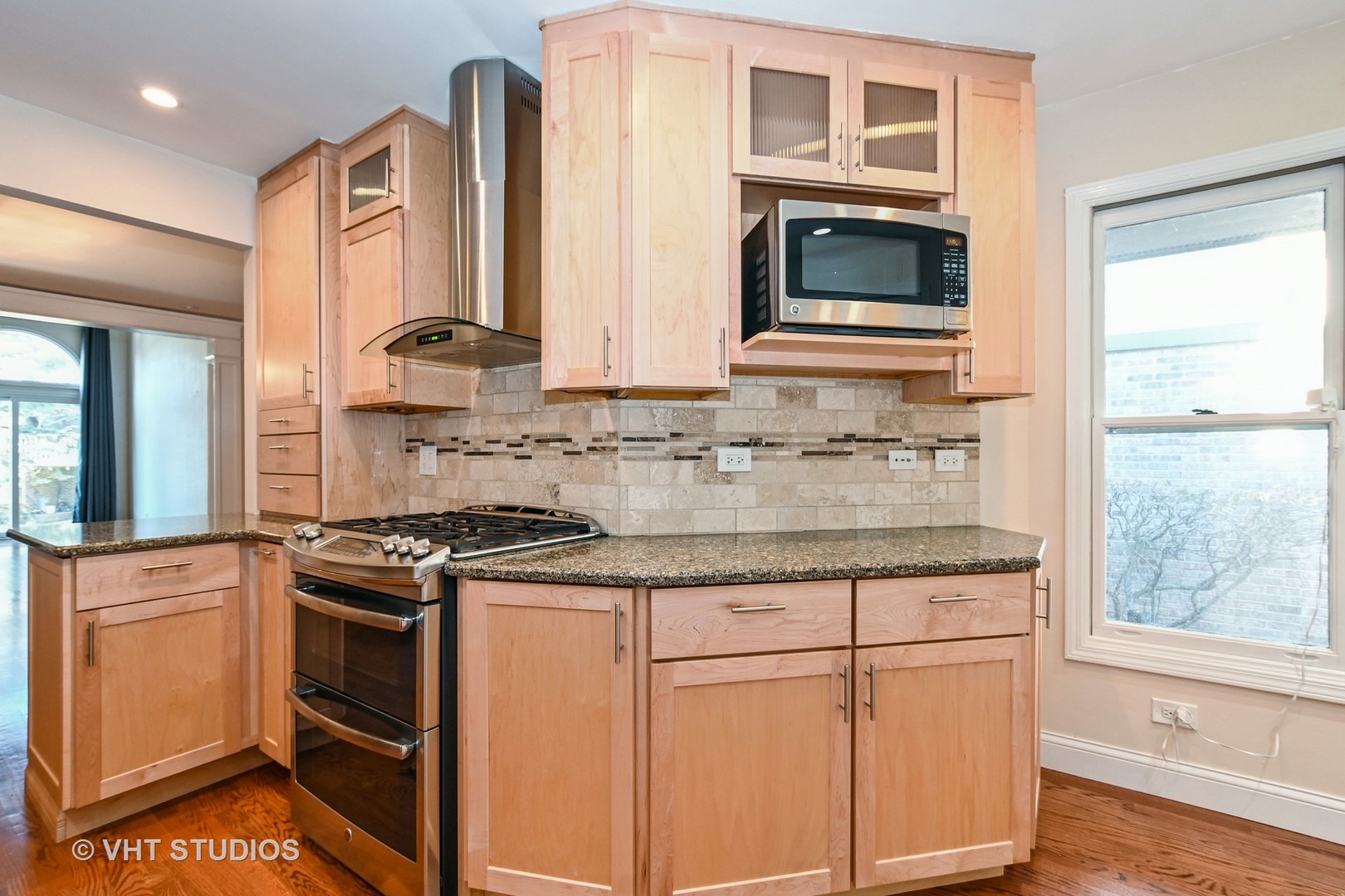 14740 Pine Tree Road Orland Park, IL 60462 - Photo 5 of 25 a kitchen with granite countertop white cabinets and white appliances