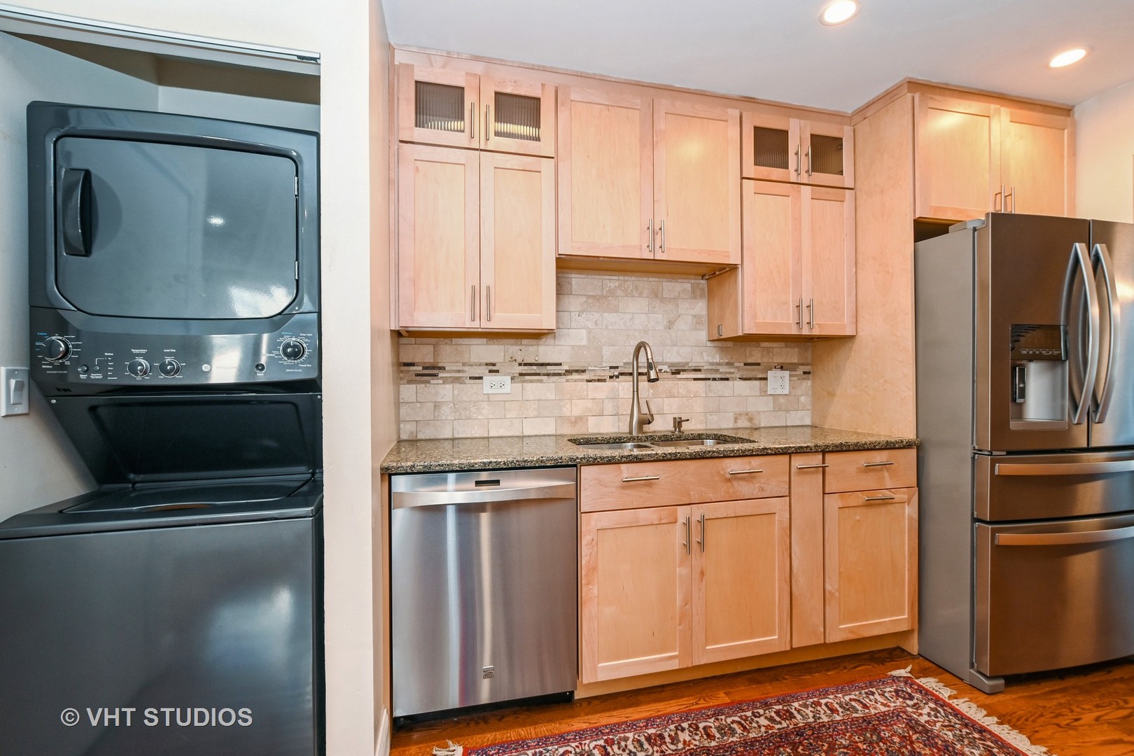 14740 Pine Tree Road Orland Park, IL 60462 - Photo 6 of 25 a kitchen with stainless steel appliances granite countertop a refrigerator a stove and a sink