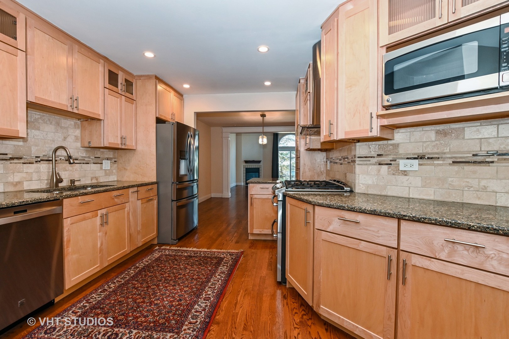 14740 Pine Tree Road Orland Park, IL 60462 - Photo 8 of 25 a large kitchen with stainless steel appliances granite countertop a sink and cabinets
