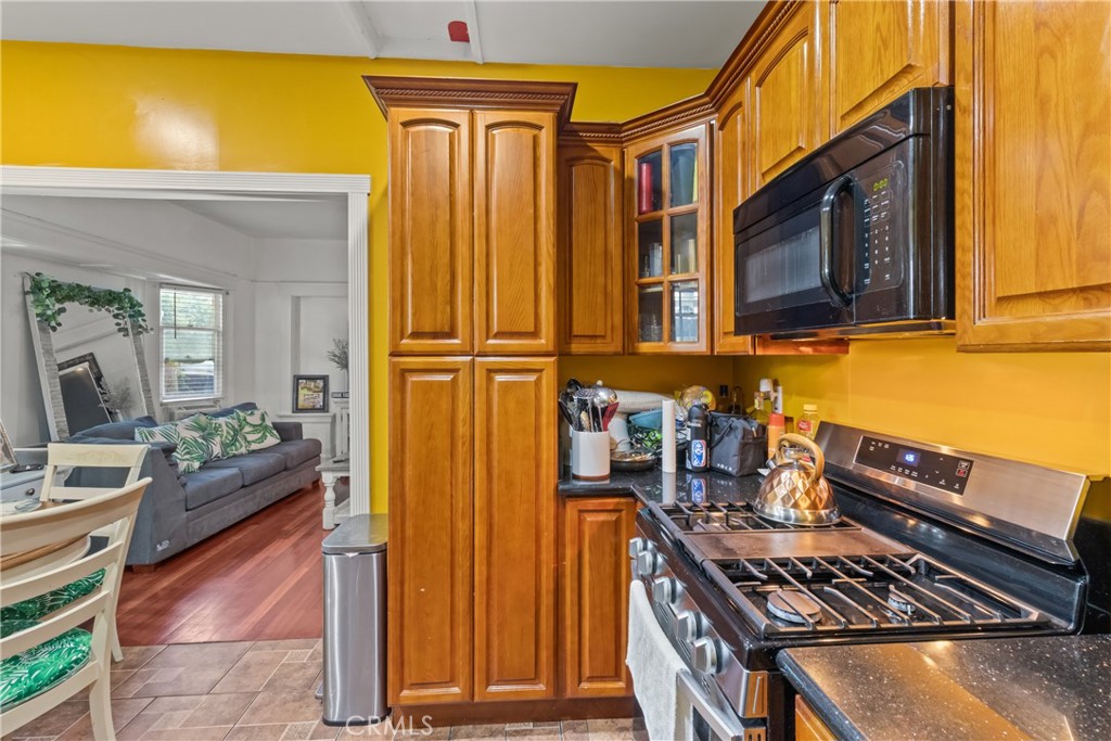 63 Yale Street Pasadena, CA 91103 - Photo 12 of 50 a backyard of a house with barbeque oven table and chairs