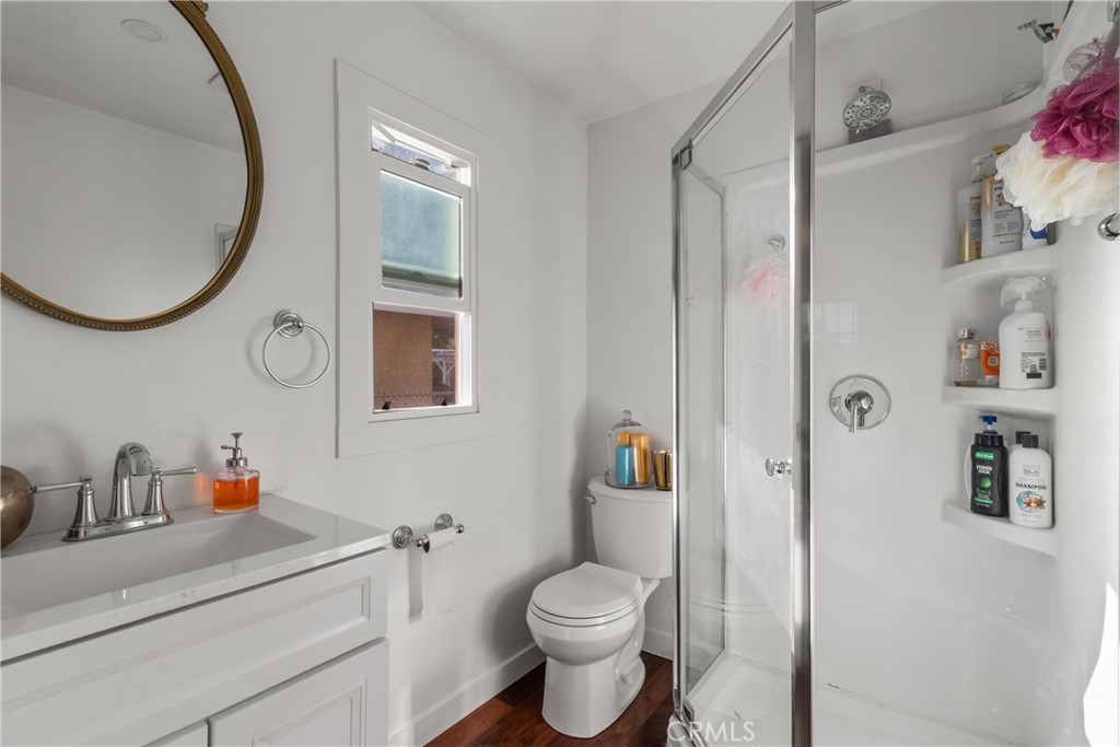 63 Yale Street Pasadena, CA 91103 - Photo 38 of 50 a bathroom with a toilet a sink and a mirror