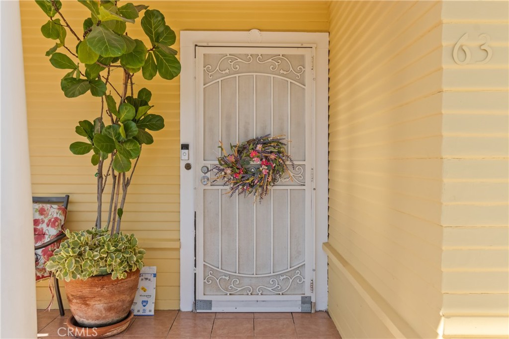 63 Yale Street Pasadena, CA 91103 - Photo 5 of 50 a view of a potted plant sitting in front of a door