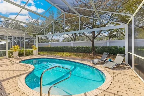 a view of a swimming pool with a patio
