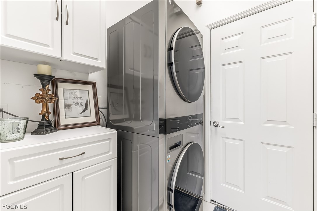 9004 Springview Loop Estero, FL 33928 - Photo 17 of 41 a close view of a utility room with dryer and washer