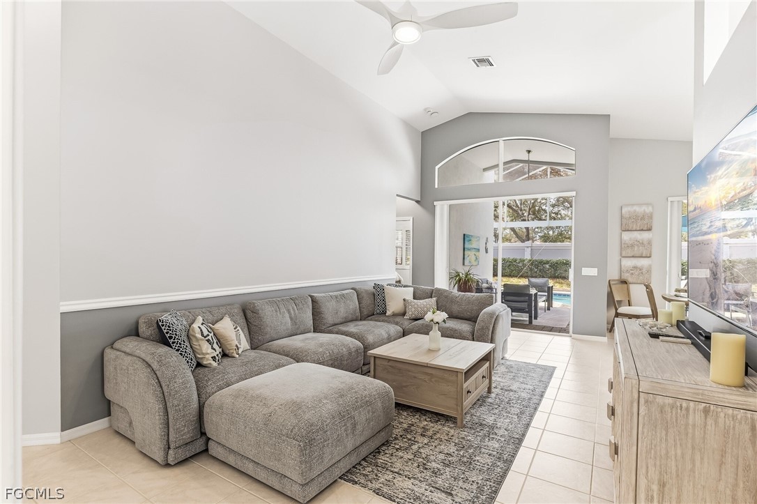 9004 Springview Loop Estero, FL 33928 - Photo 18 of 41 a living room with furniture and a large window