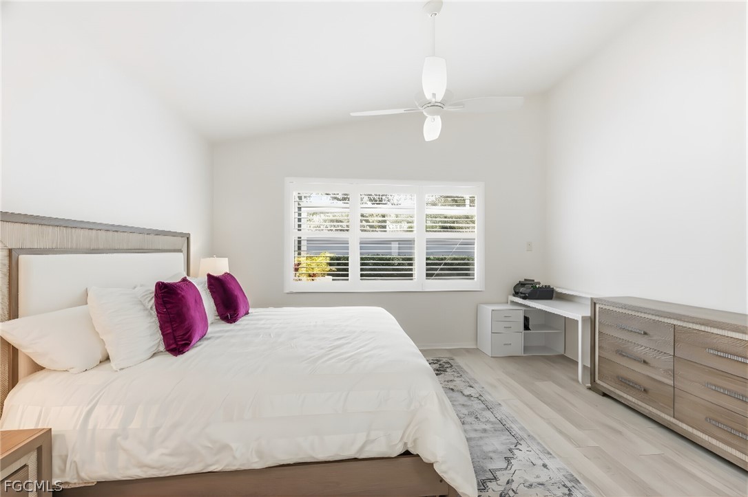 9004 Springview Loop Estero, FL 33928 - Photo 19 of 41 a bedroom with a large bed and a window
