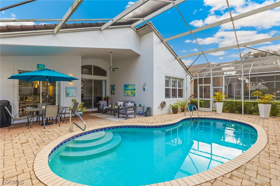 9004 Springview Loop Estero, FL 33928 - Photo 23 of 41 a view of a swimming pool with chairs
