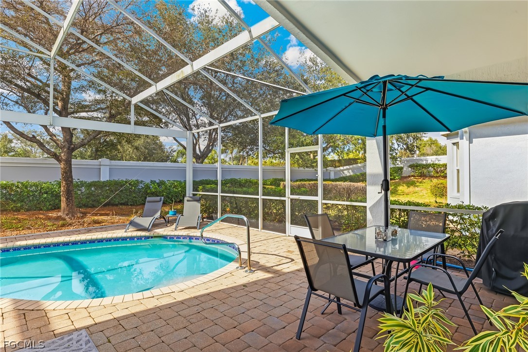 9004 Springview Loop Estero, FL 33928 - Photo 25 of 41 a view of a chairs and table in the patio