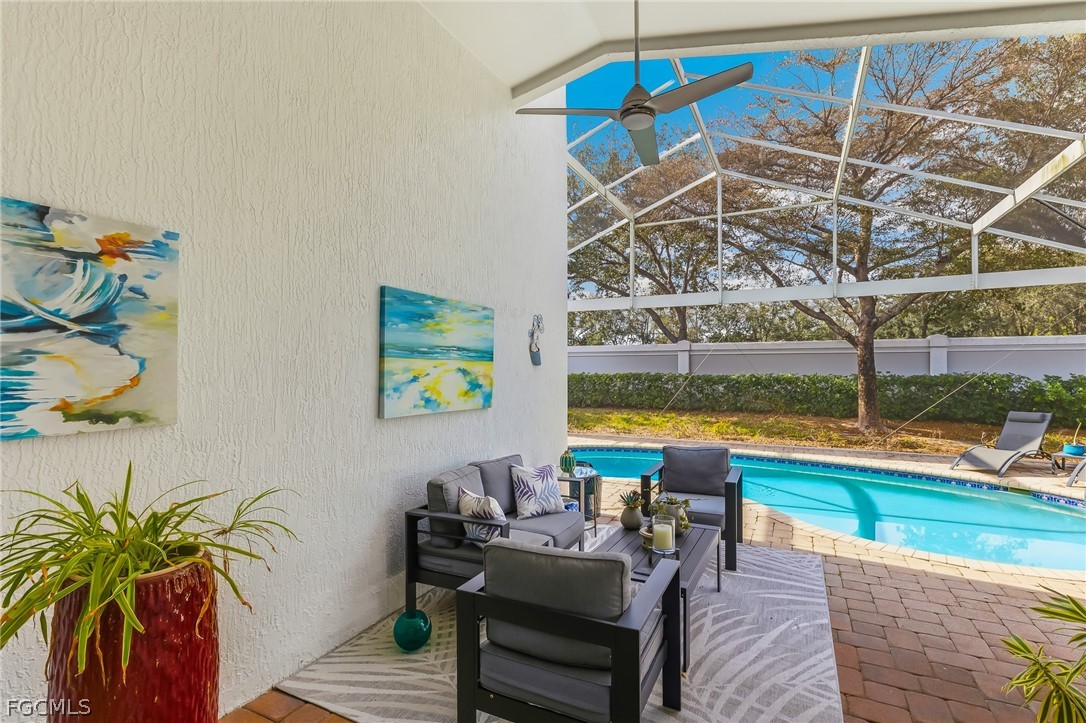 9004 Springview Loop Estero, FL 33928 - Photo 26 of 41 a living room with patio area and a potted plant