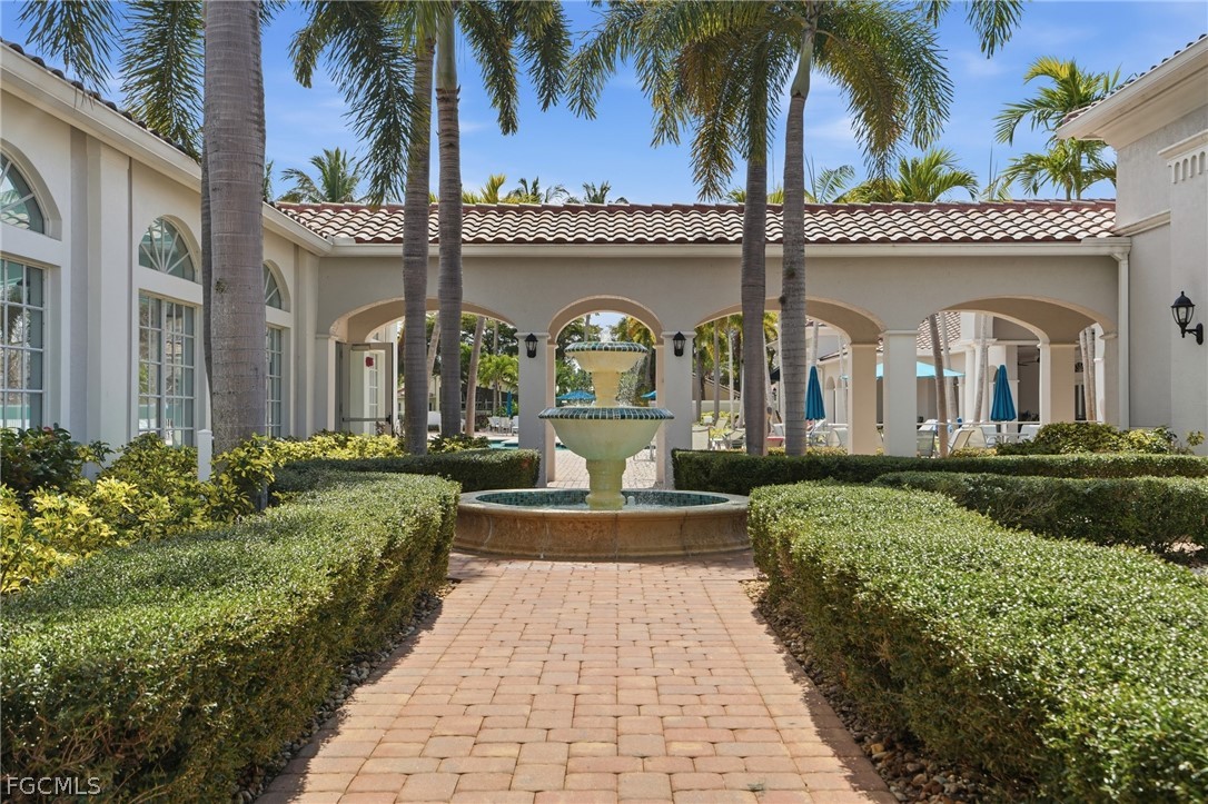 9004 Springview Loop Estero, FL 33928 - Photo 33 of 41 a front view of a house with a garden