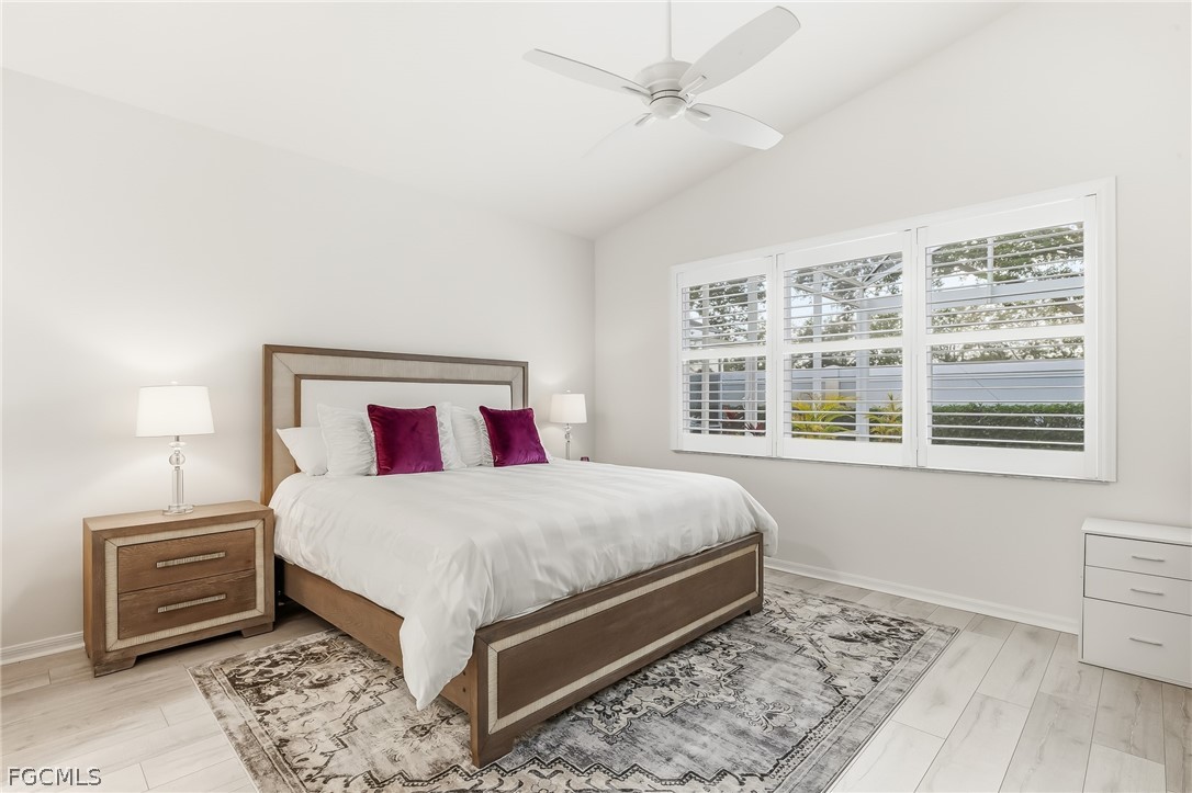 9004 Springview Loop Estero, FL 33928 - Photo 10 of 41 a bedroom with a large bed and a window