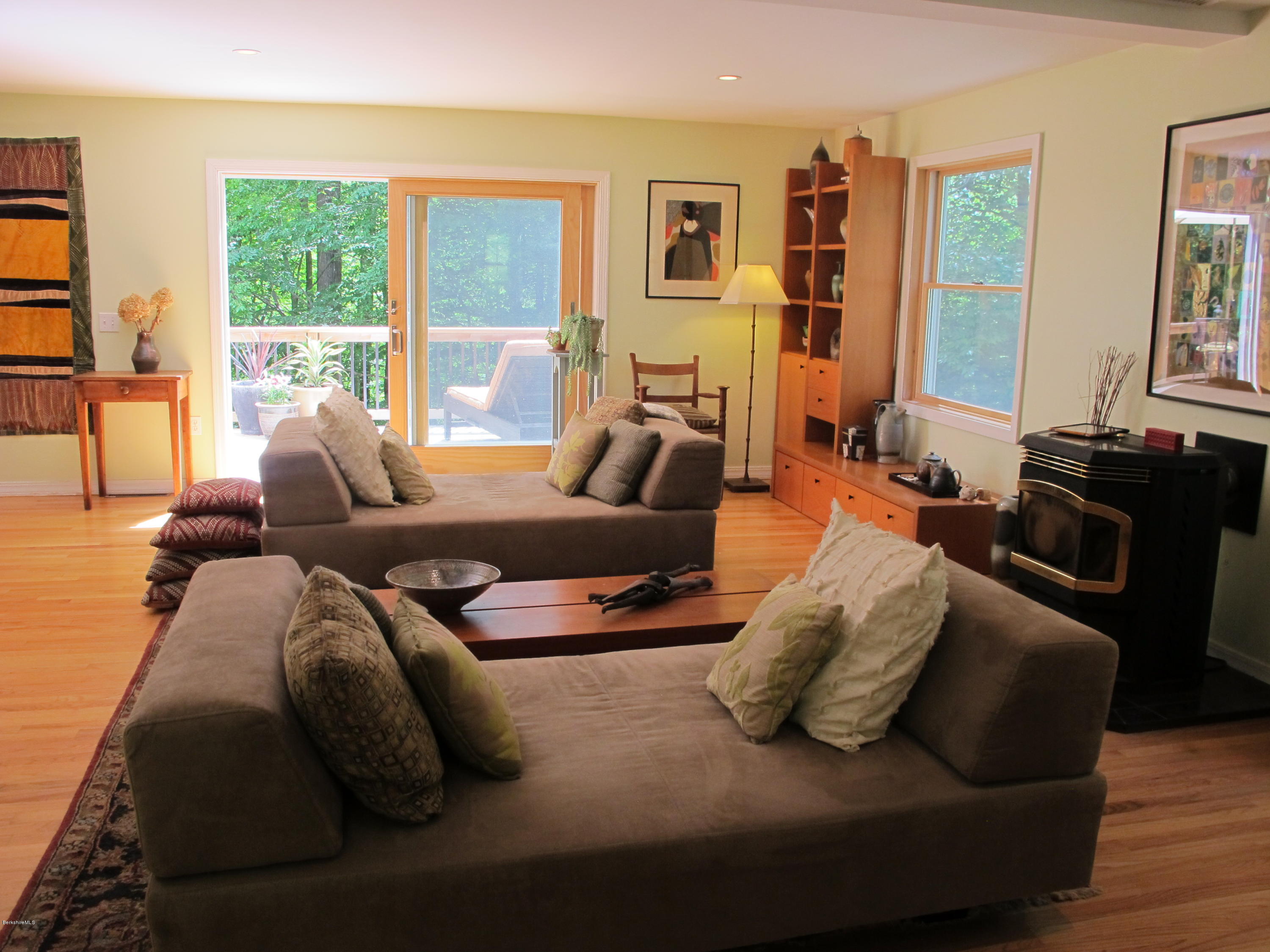 4 Stonebridge Way Tyringham, MA 01264 - Photo 12 of 40 a living room with furniture and large windows