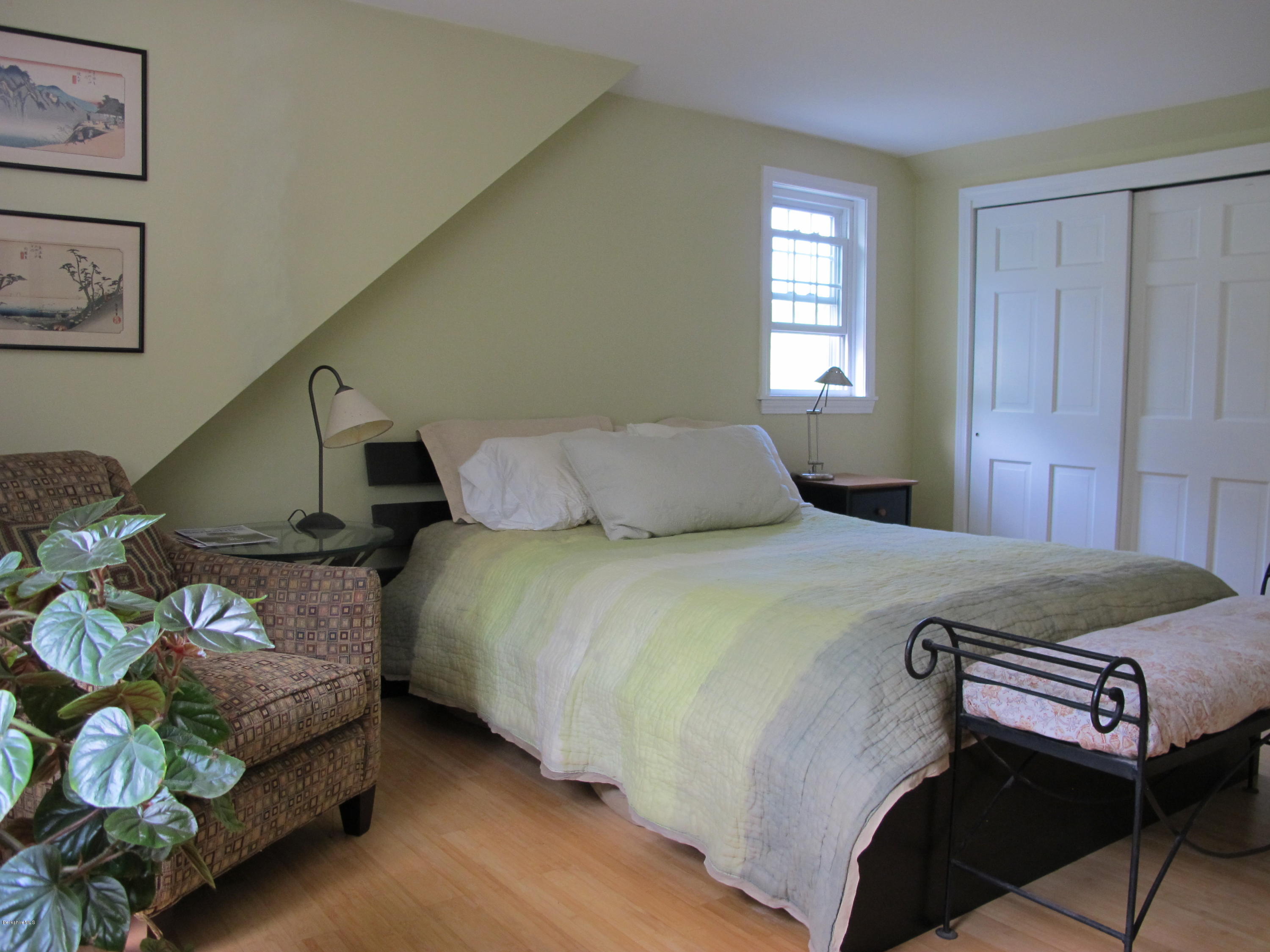 4 Stonebridge Way Tyringham, MA 01264 - Photo 24 of 40 a bedroom with a bed lamp and a window