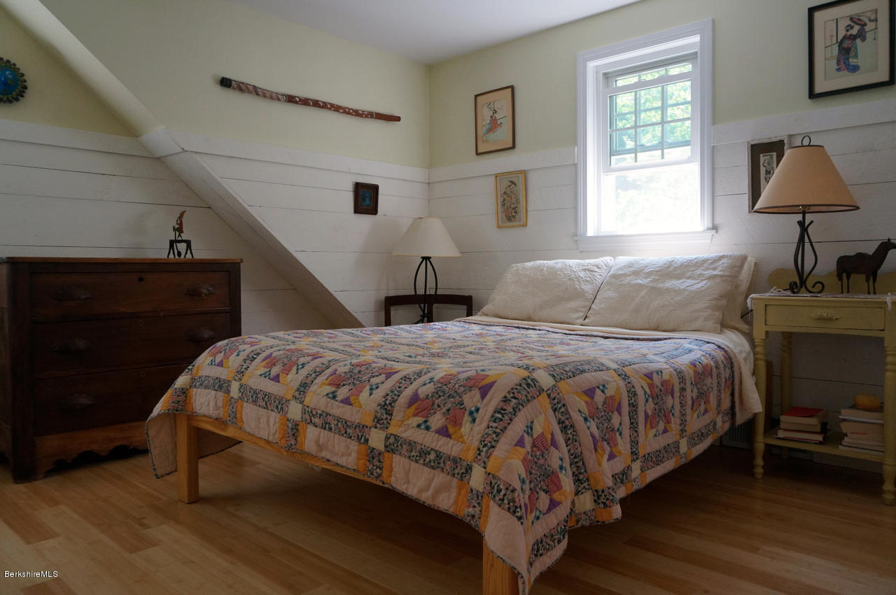 4 Stonebridge Way Tyringham, MA 01264 - Photo 28 of 40 a bedroom with a bed and window