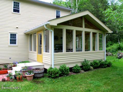 4 Stonebridge Way Tyringham, MA 01264 - Photo 31 of 40 a front view of a house with a garden